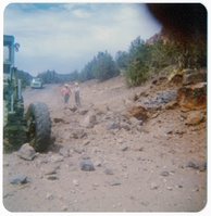 Men discussing road work, observing a pile of rocks during road work along the Kolob Terrace Road.