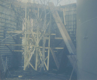 Scaffolding built between water tanks during reroofing project.