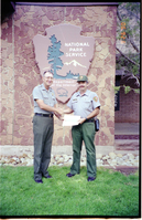 Color Photos of Superintendent Harold Grafe giving out awards to park personnel.