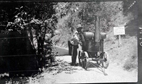 Narrows Trail construction with worker operating the oil heater used in spraying on the bitumuls 50.