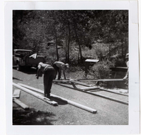 Construction activity - preparing lumber/scaffolding.