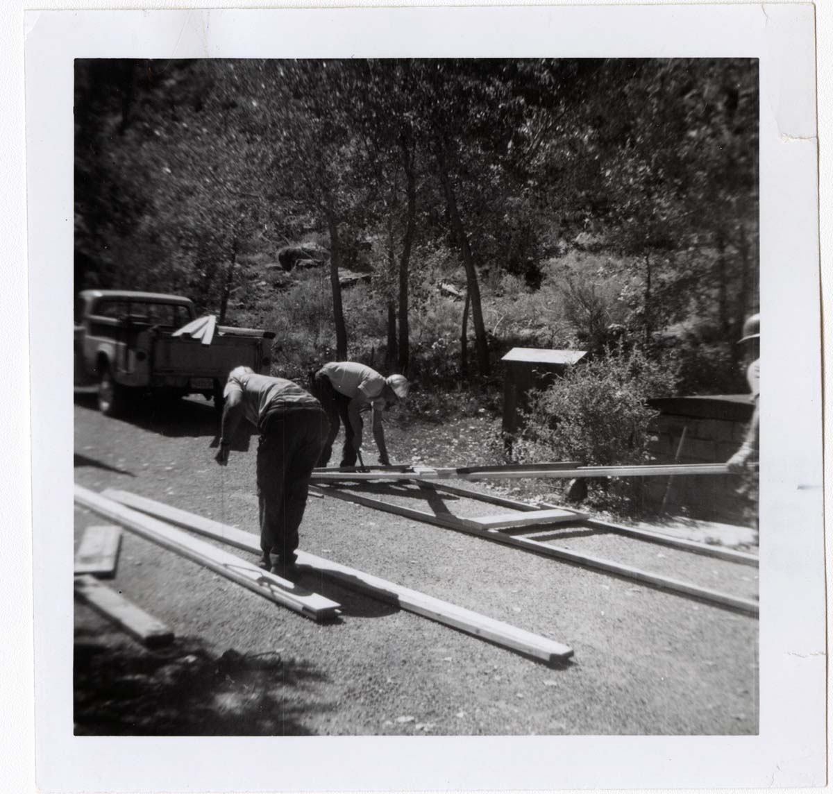 Construction activity - preparing lumber/scaffolding.