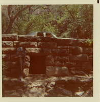 Car driving over bridge/culvert.