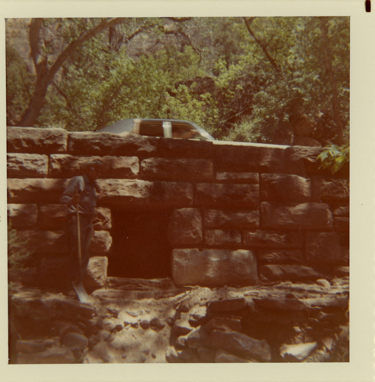 Car driving over bridge/culvert.