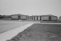 Barracks and parking area. Building numbers 51 and 52. [Image possibly for comparative housing study]