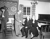 Superintendent Franke presenting going away gift and 20 year service award pin to Ken Culmers, at the ranger dormitory.