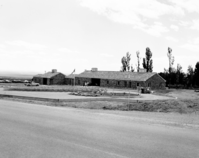 Chairs and grandstand in the parking area set up prior to dedication of new Tribal and National Park Service Visitor Center and 50th anniversary celebration at Pipe Spring National Monument.