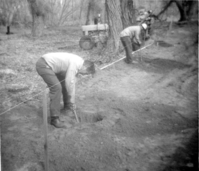 Workers clearing/cleaning and setting up the lodge spray field.