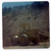Excavator clearing debris for road work in Kolob Canyon.