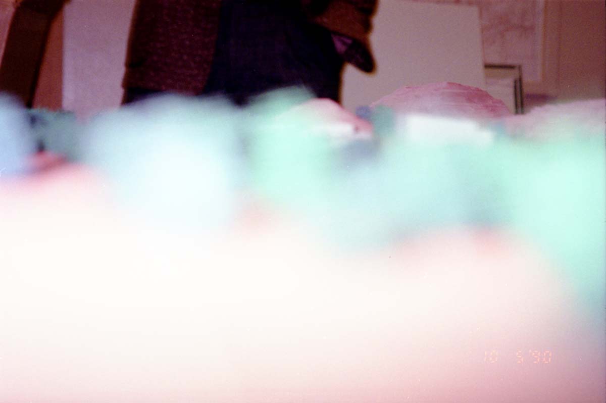 Color photos of an architectural model for an early proposed IMAX complex.