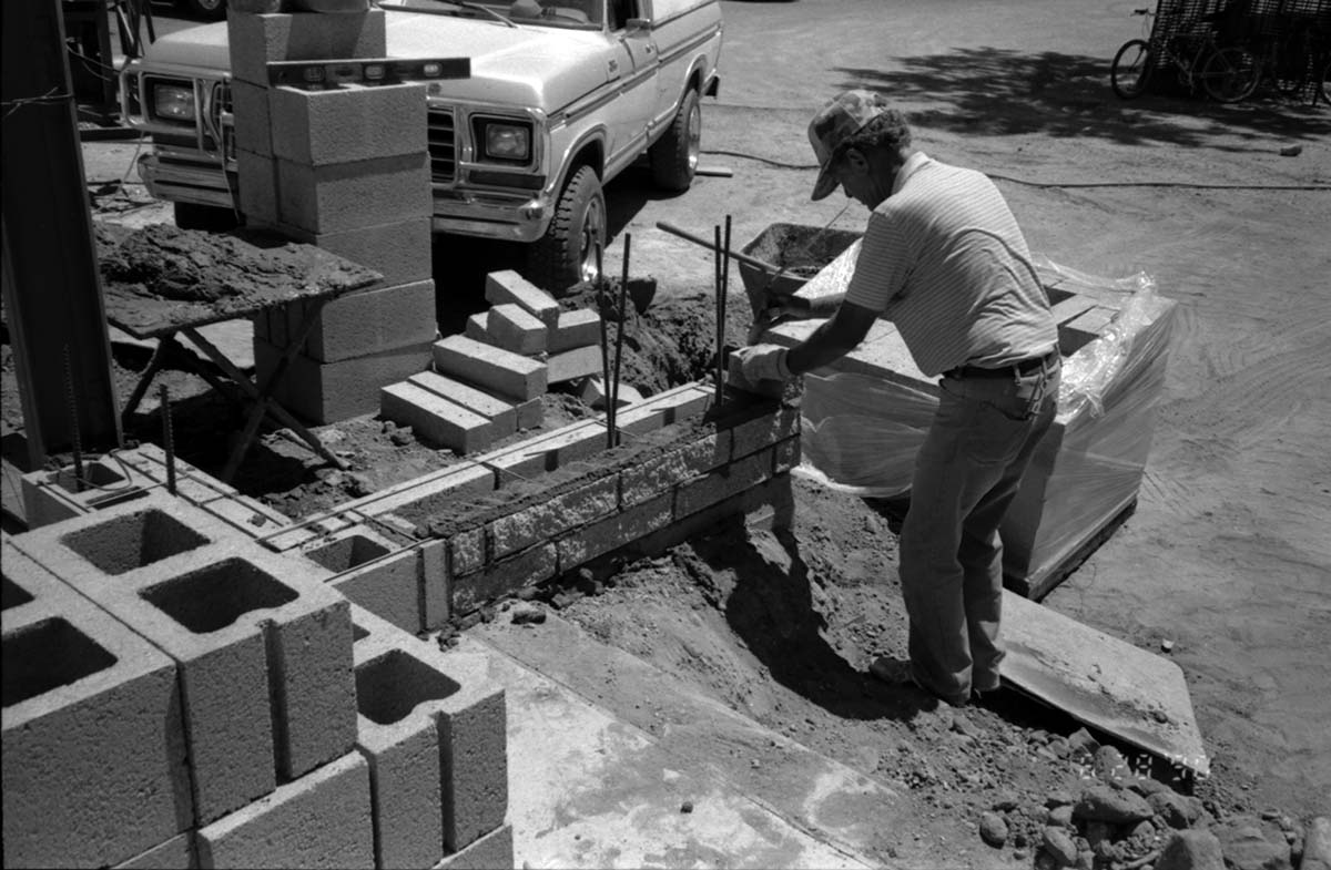 Man working on the construction of headquarters addition.