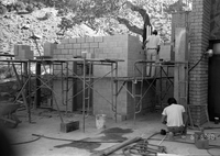 Man working during construction of headquarters addition.