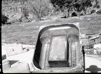 Shop-made form for making cinder concrete, monolithic cast campground fireplaces, in utility area.