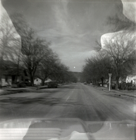 Tree and house lined section of State Route 9 (SR-9).