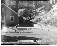 Workers pouring concrete at the ranger dormitory parking area.