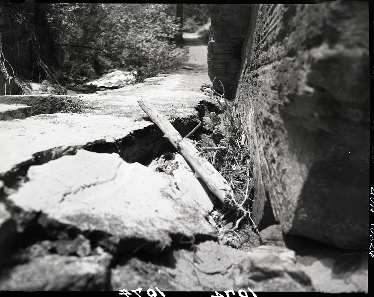 Damage done by storm of July 25, 1954 to West Rim Trail. Section of undermined trail in Refrigerator Canyon.