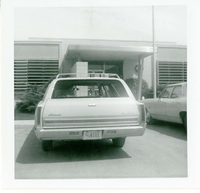 Vehicle parked in parking lot of the old Mission 66 Visitor Center and Museum.