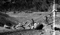 Basket dam #1 construction along the Virgin River with a view of willow mat underneath the wire.