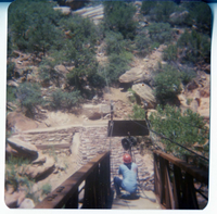 Man rigging the pulley system to move the new Grotto footbridge into place across the Virgin River.