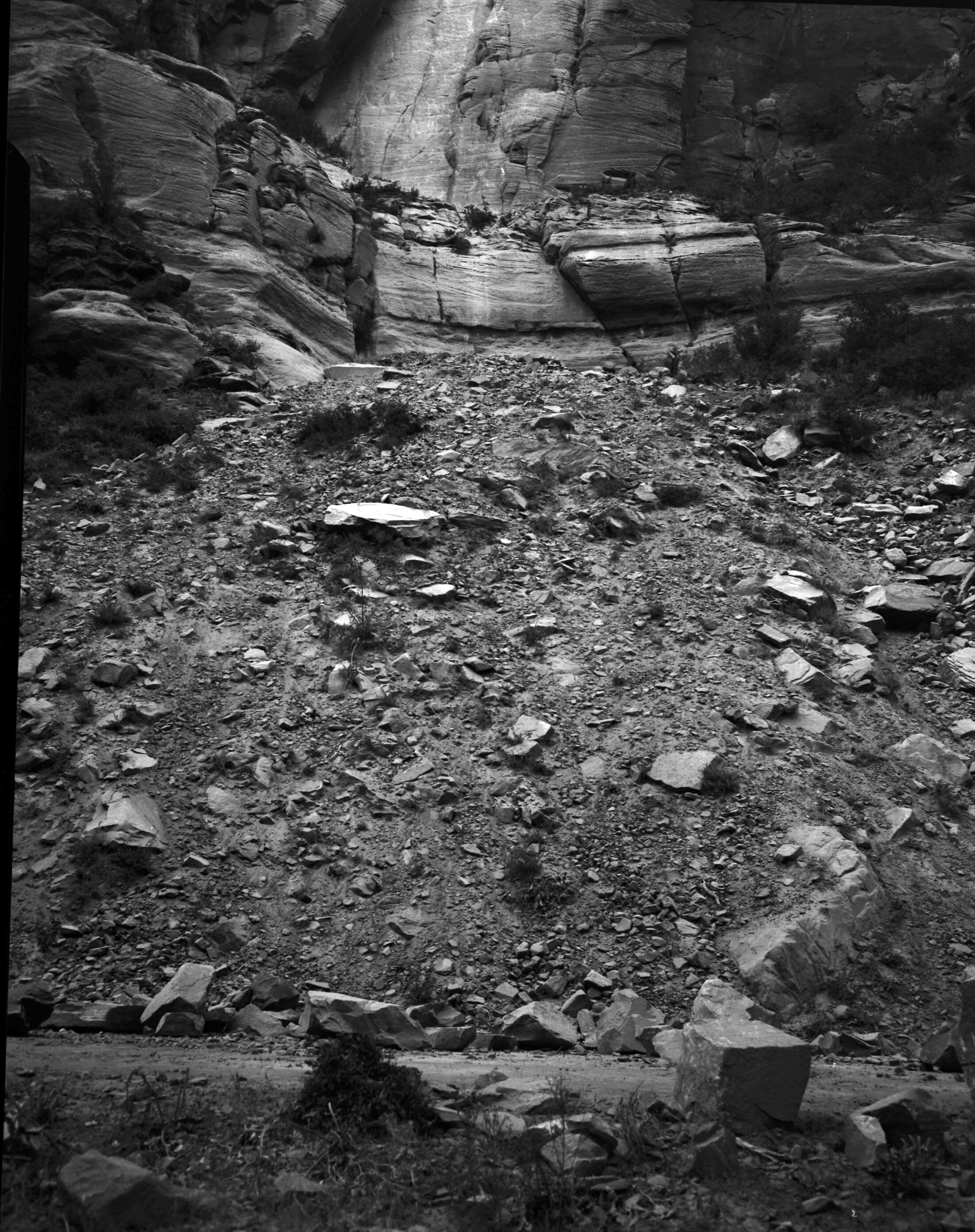 Rock slide along park road above Grotto Campground, looking up canyon.