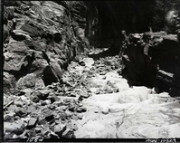 Damage done by storm of July 25, 1954 to West Rim Trail. Looking down on trail just below Walter's Wiggles.