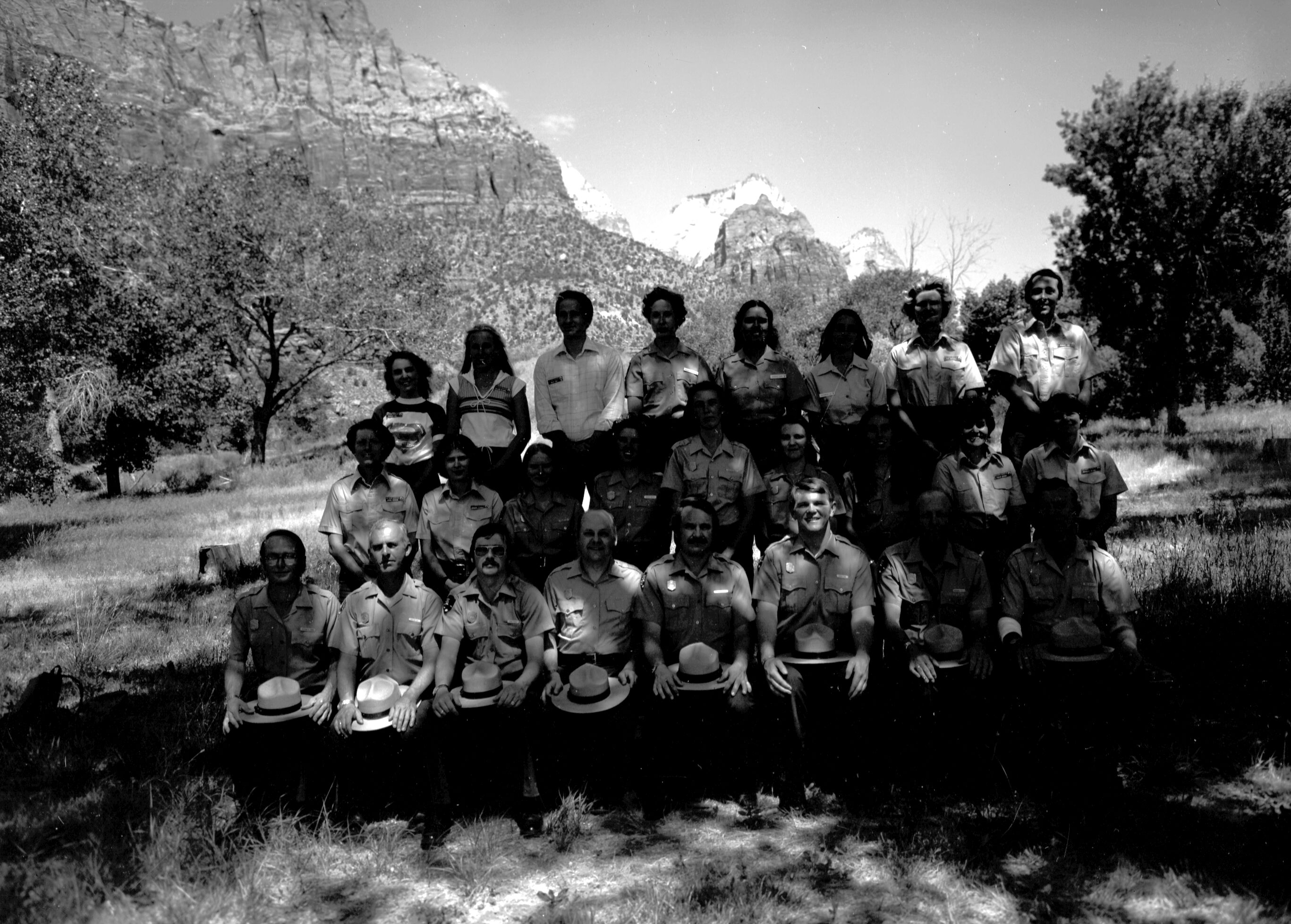 Personnel 1980: naturalist division, Student Conservation Association (SCA), Zion Natural History Association (ZNHA), Zion Nature School (ZNS). Front row (left to right): (two unidentified people), Bob Wood, Victor Jackson, John Lancaster, Roy Given, (two unidentified people). Center row (left to right): Caroline Nicholson, Marion Hilkey, (seven unidentified people). Top row (left to right): Joel Fishbien, Chris Dick, (five unidentified people), Kathy Picarelli.