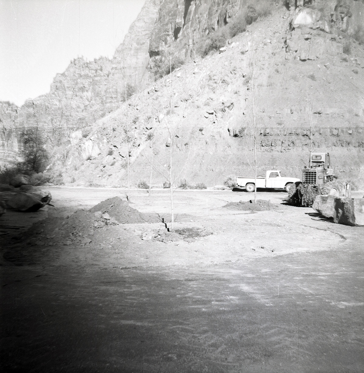 Construction vehicles clearing road during road grading to Chamberlain Ranch and the Narrows.