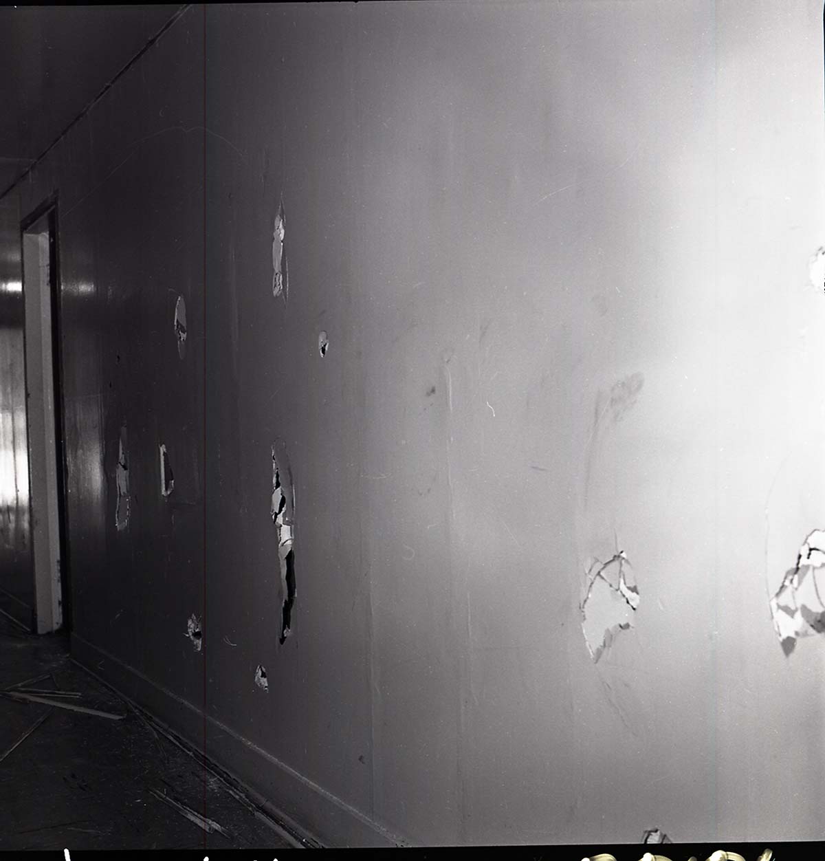 Damage to men's dorm at Zion Lodge. Damage to the hallway walls and floor.