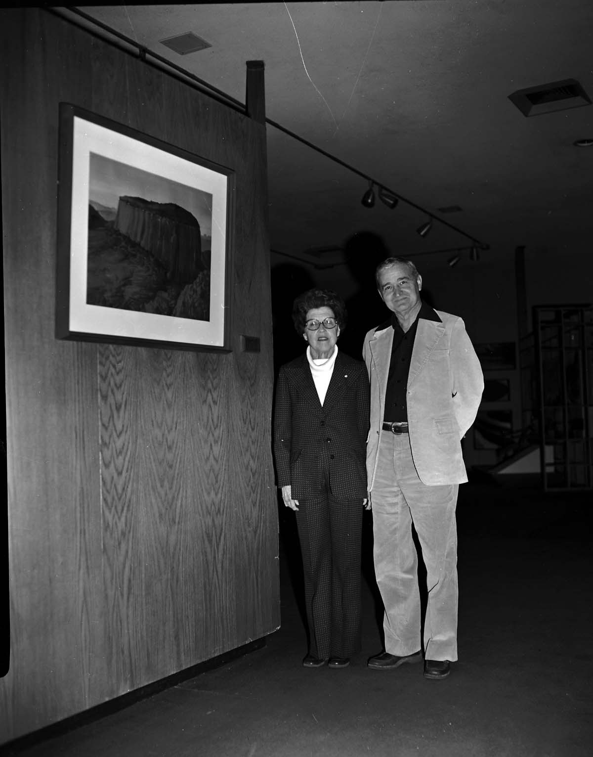 Dr. W. Larson presents plaque and painting to Mrs. Ethel Farnsworth in memory of her husband Dr. Reed Farnsworth, who was a Zion Natural History Association (ZNHA) board member. The painting is of Timbertop Mountain by Leek.