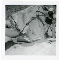 Construction vehicle placing rock during the Lady Mountain sign emplacement.