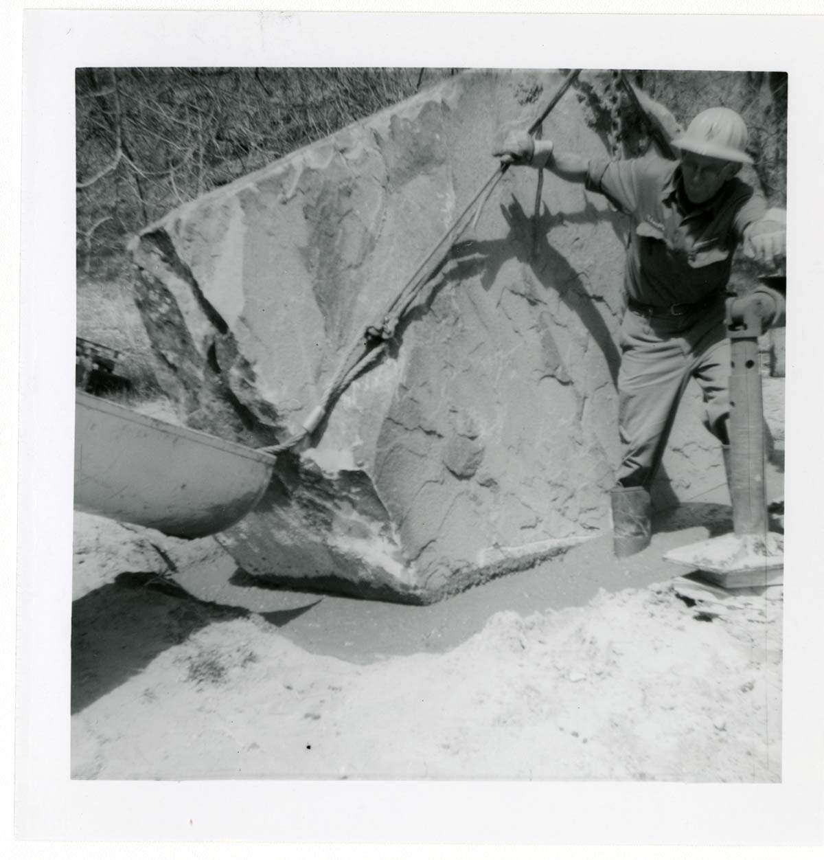 Construction vehicle placing rock during the Lady Mountain sign emplacement.