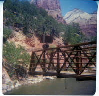 The new Grotto footbridge moving across the Virgin River by pulley system.