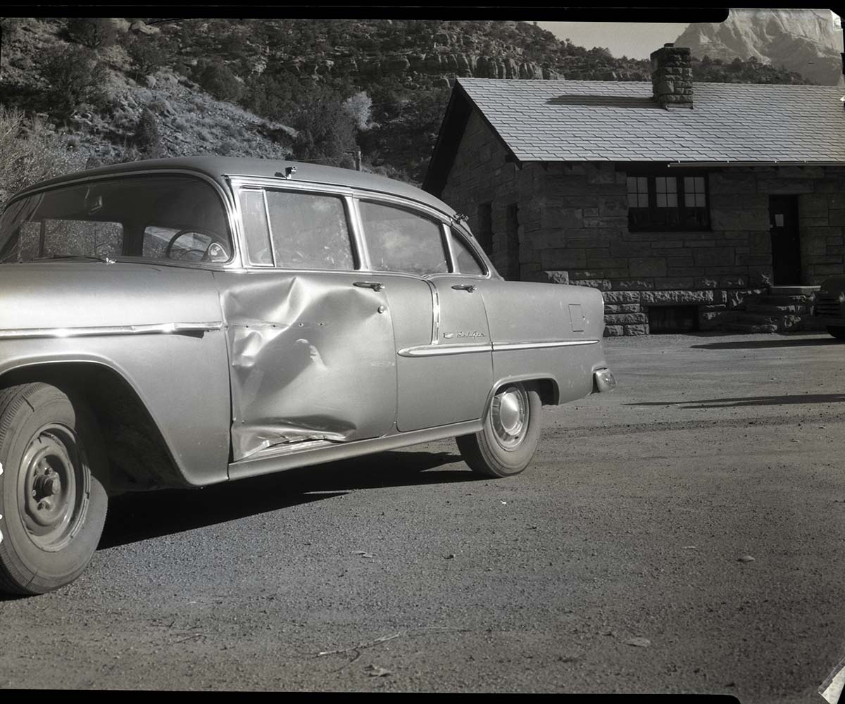 Mock accident to illustrate result of careless driving.