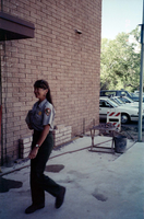 Woman walking during the construction of headquarters addition.