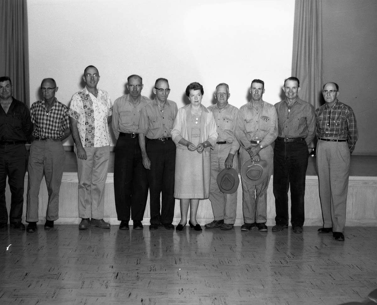 Recipients of Service Awards for 10, 20, and 30 years of service standing in the Mission 66 Visitor Center and Museum auditorium.