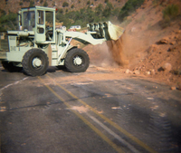 Color Photo of a rock slide near the junction of routes 1 and 2.