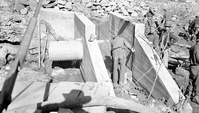 Civilian Conservation Corps (CCC) workers and park laborers completing work on a diversion dam 'spill slue way.' [Original negative number 1167.]