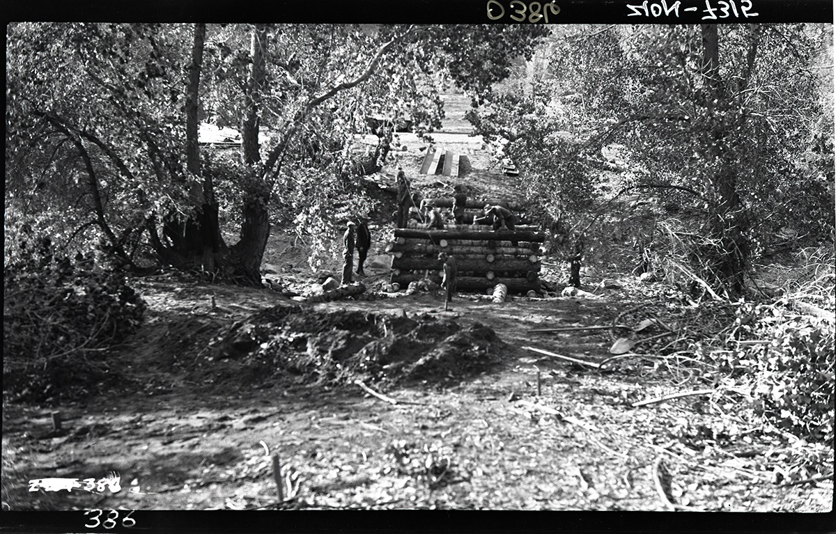 Bridge Across Virgin River with several Civilian Conservation Corps (CCC) workers constructing log structure.