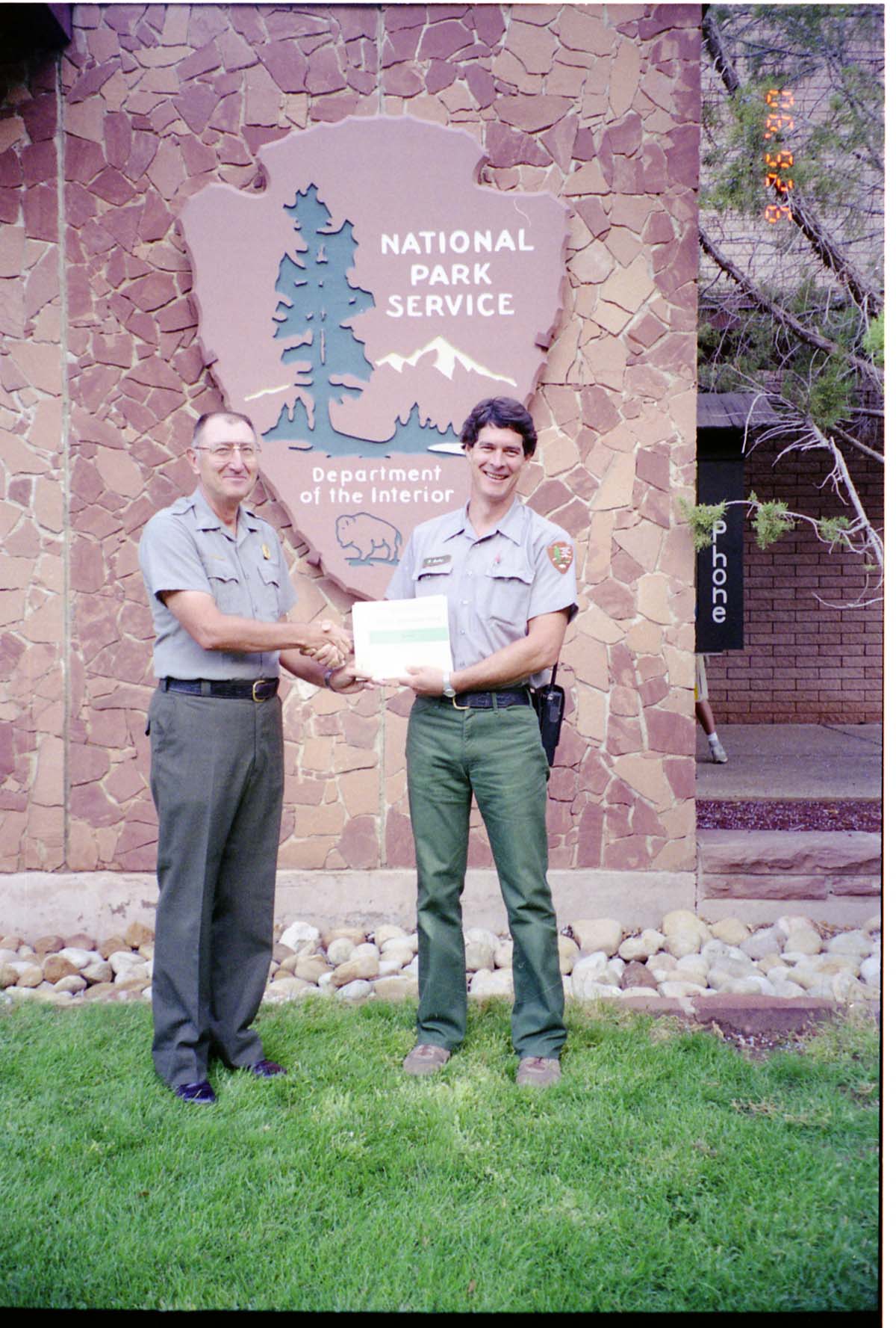 Color Photos of Superintendent Harold Grafe giving out awards to park personnel.