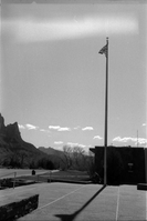 Flag pole with flag flying at top outside of the old Mission 66 Visitor Center and Museum.