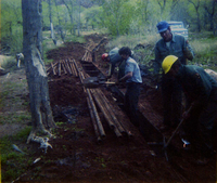 Workers using shovels during the uncovering of the irrigation ditch in South Campground.