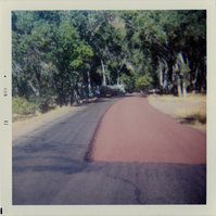 Sealcoat work on road.