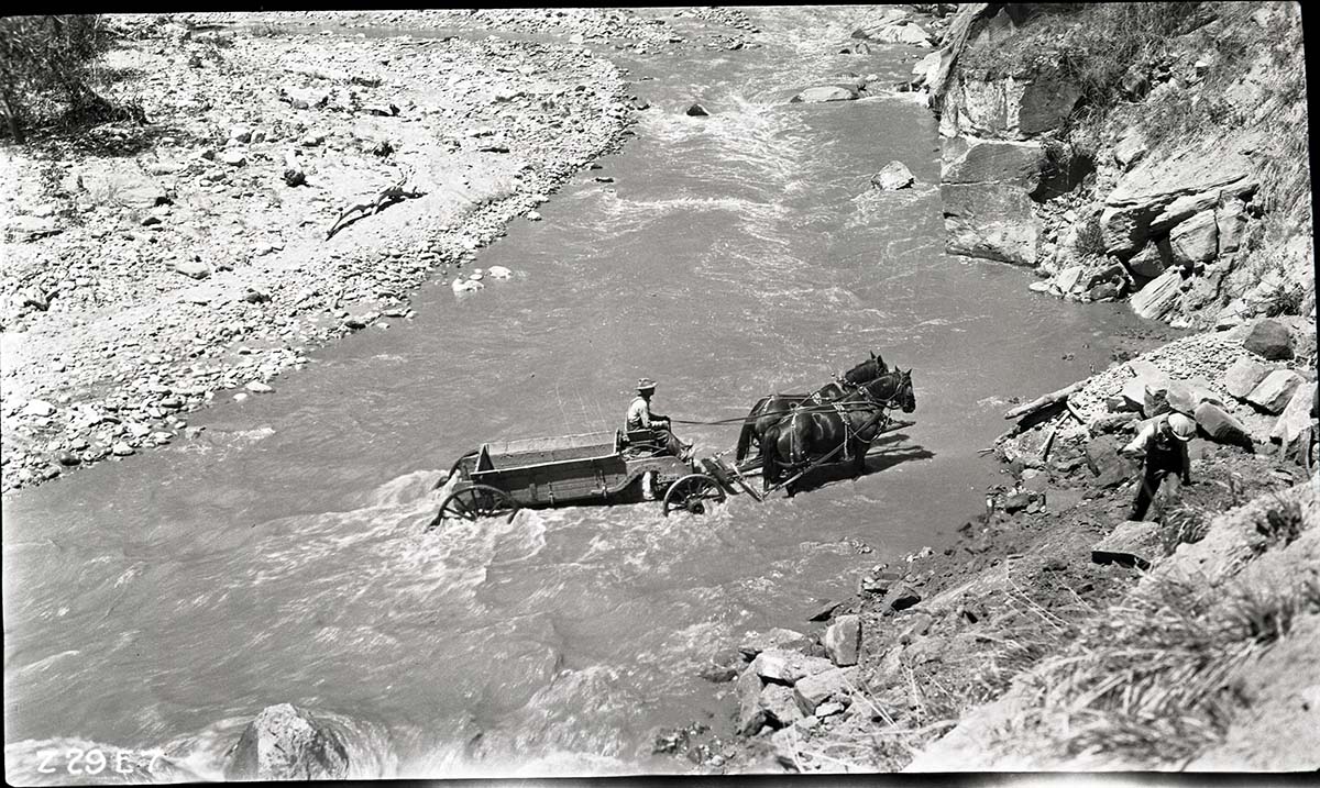 Narrows Trail construction- view of a man on a horse drawn wagon crossing the Virgin River.