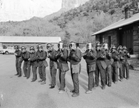 Crowd control training, shop area. Shows NPS personnel in riot gear.