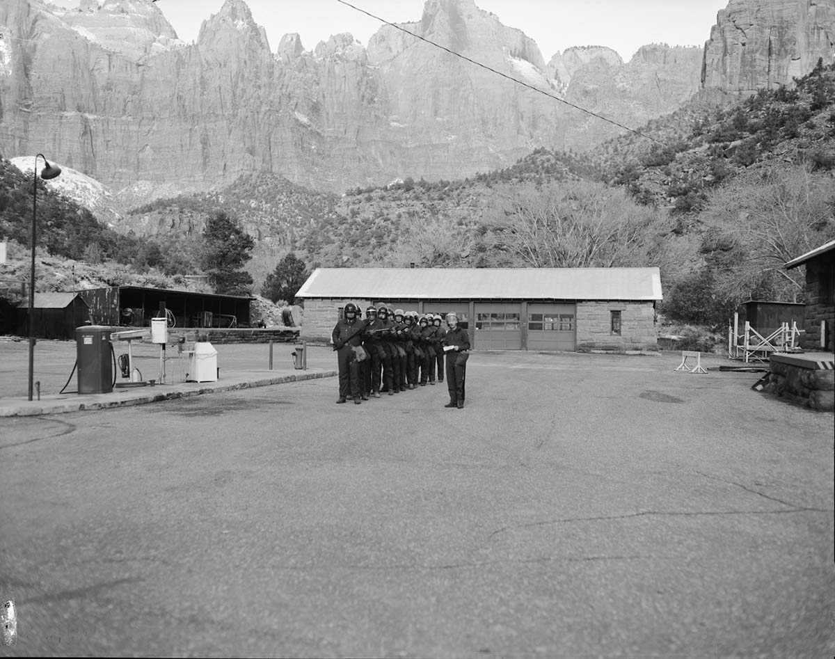 Crowd control training, shop area. Shows NPS personnel in riot gear.
