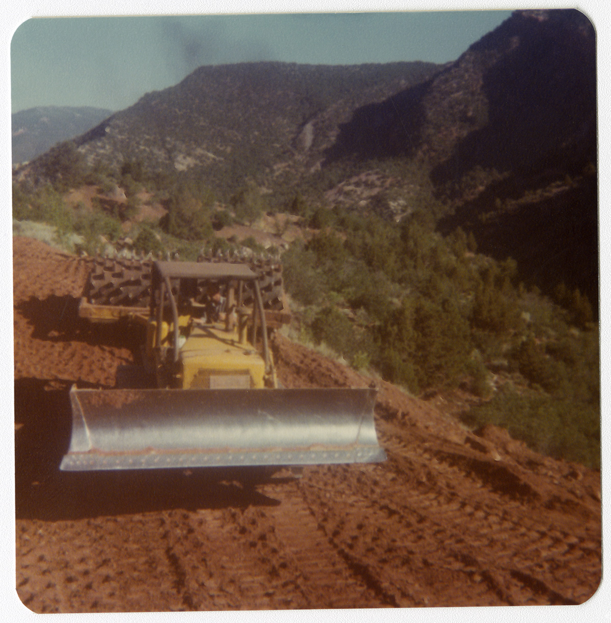 Excavator clearing road during road work/repair in Kolob Canyon.