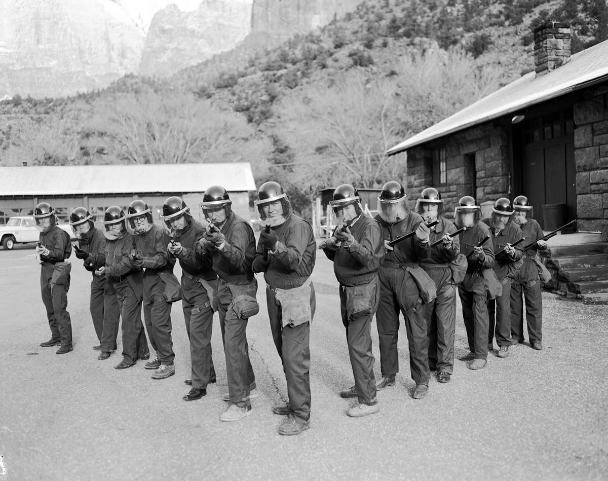 Crowd control training, shop area. Shows NPS personnel in riot gear.