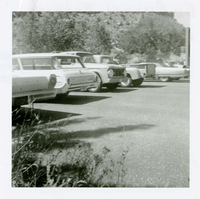 Vehicles parked in the parking lot of the old Mission 66 Visitor Center and Museum.