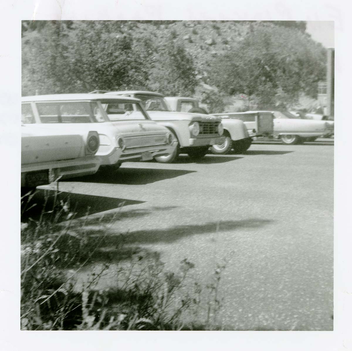 Vehicles parked in the parking lot of the old Mission 66 Visitor Center and Museum.