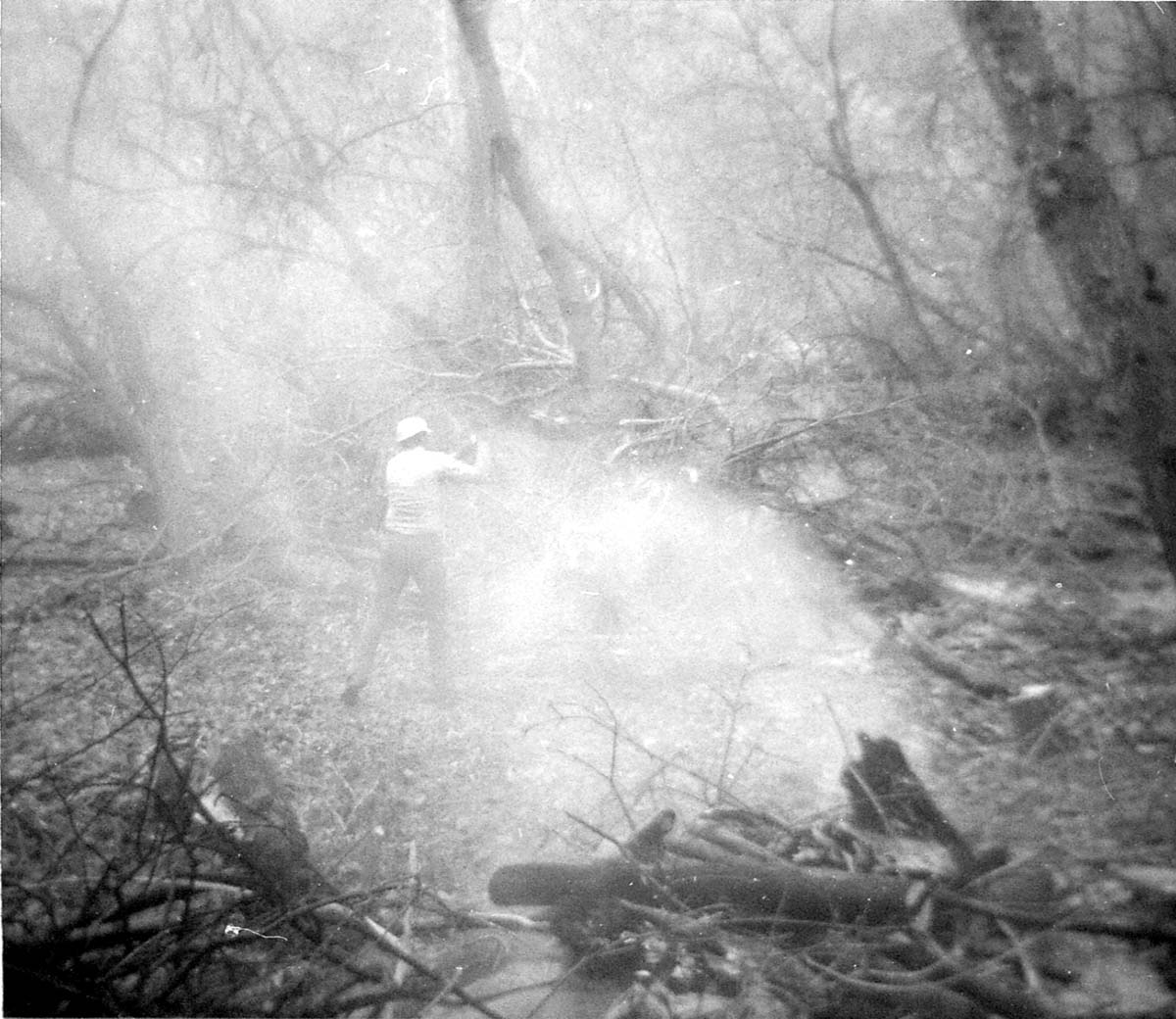 Worker clearing the lodge spray field prior to set up.